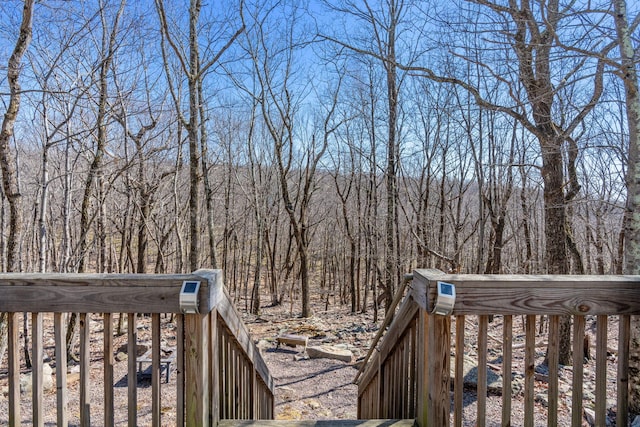 deck featuring a forest view