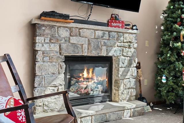 details featuring carpet flooring and a stone fireplace