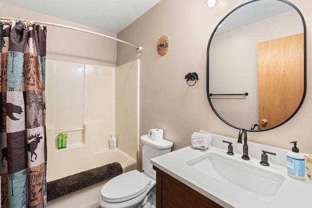 bathroom featuring toilet, vanity, and shower / tub combo