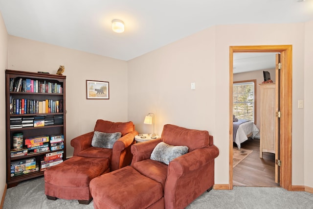 sitting room with carpet flooring and baseboards