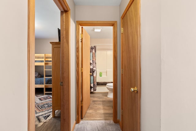 hall featuring wood finished floors