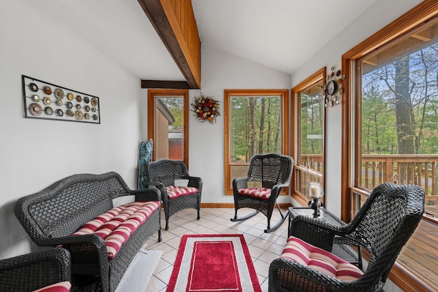 sunroom with tile patterned flooring and vaulted ceiling