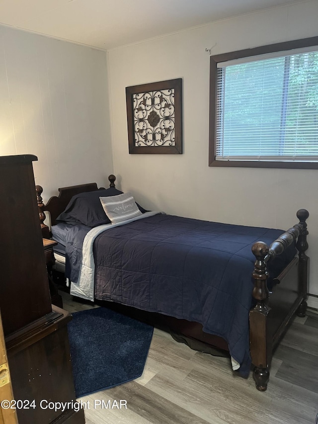 bedroom with wood finished floors