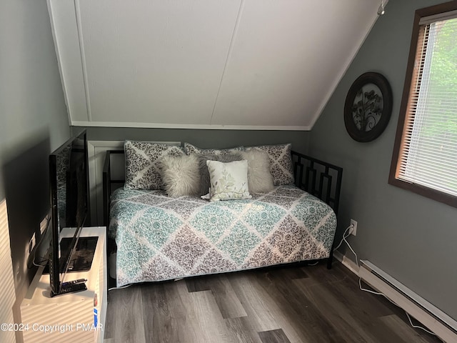 bedroom with lofted ceiling, baseboards, baseboard heating, and wood finished floors