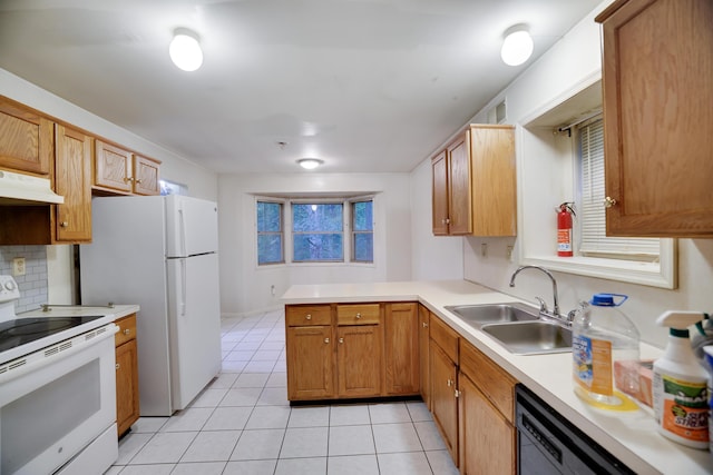 3122 Sparrow Ct, East Stroudsburg, PA 18302 - kitchen featuring white appliances, under cabinet range hood, light tile patterned floors, light countertops, and a peninsula