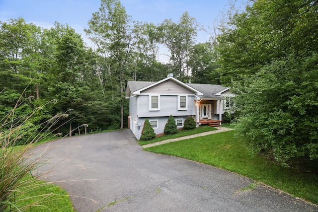 3122 Sparrow Ct, East Stroudsburg, PA 18302 - view of front of house with asphalt driveway, a garage, and a front yard