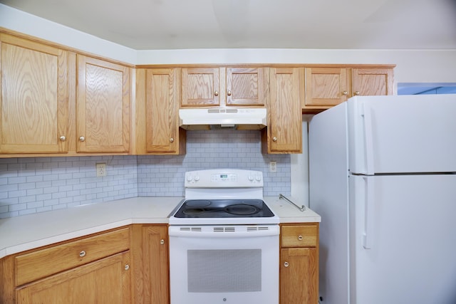 3122 Sparrow Ct, East Stroudsburg, PA 18302 - kitchen with white appliances, under cabinet range hood, light countertops, and decorative backsplash
