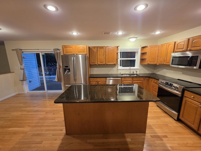 210 Grouse Run, Cresco, PA 18326 - kitchen featuring appliances with stainless steel finishes, a center island, light wood-style floors, dark stone counters, and recessed lighting