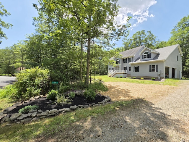 210 Grouse Run, Cresco, PA 18326 - view of front of house featuring dirt driveway, a garage, and a shingled roof