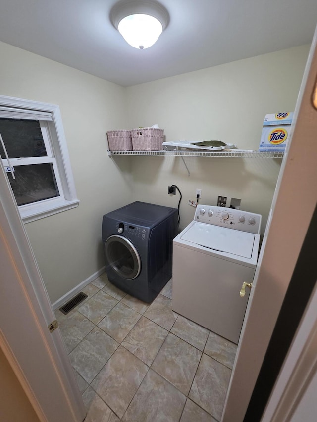 210 Grouse Run, Cresco, PA 18326 - laundry room with washing machine and clothes dryer and light tile patterned floors
