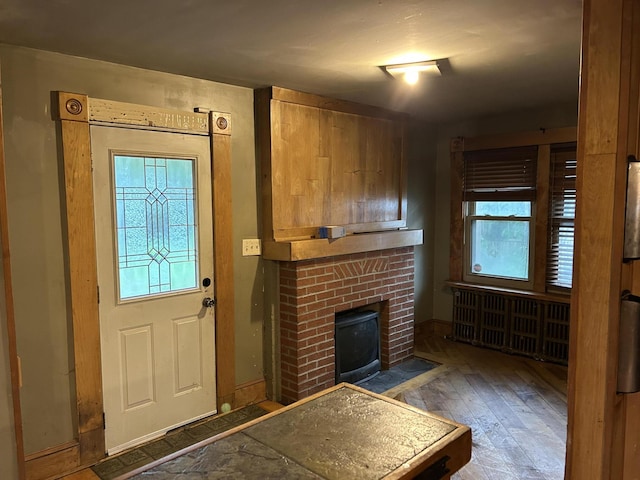 58-60 Broad St, Stroudsburg, PA 18360 - entryway featuring hardwood / wood-style floors and a brick fireplace