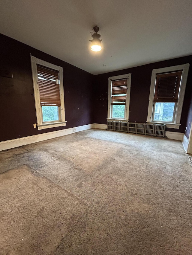 58-60 Broad St, Stroudsburg, PA 18360 - spare room with carpet flooring, plenty of natural light, and radiator