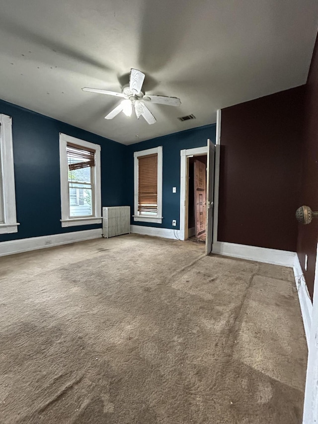 58-60 Broad St, Stroudsburg, PA 18360 - unfurnished bedroom featuring carpet flooring, radiator, and ceiling fan