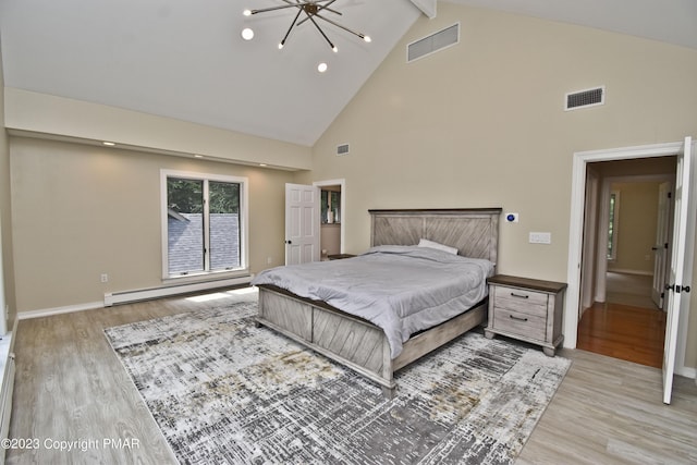386 Camelback Rd, Tannersville, PA 18372 - bedroom featuring high vaulted ceiling, light wood-type flooring, visible vents, a baseboard radiator, and beam ceiling
