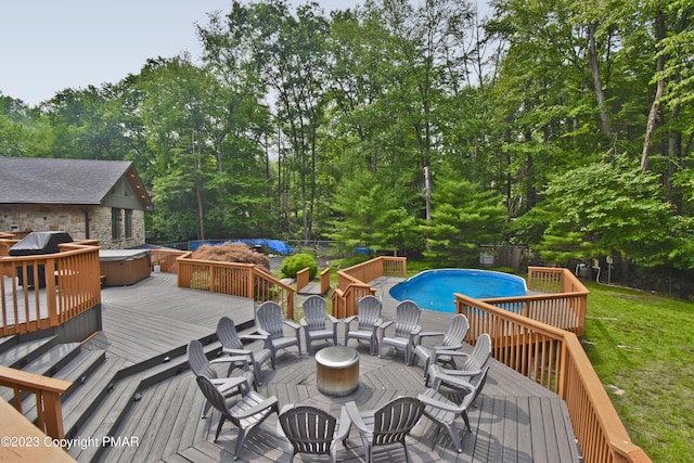386 Camelback Rd, Tannersville, PA 18372 - wooden terrace with an outdoor pool, fence, a fire pit, and a yard