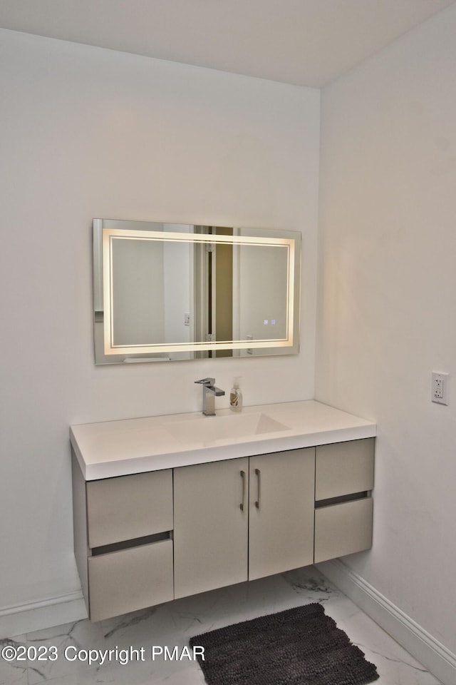 386 Camelback Rd, Tannersville, PA 18372 - bathroom featuring marble finish floor, baseboards, and vanity