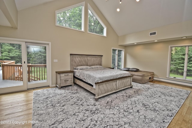 386 Camelback Rd, Tannersville, PA 18372 - bedroom with high vaulted ceiling, access to outside, multiple windows, and visible vents