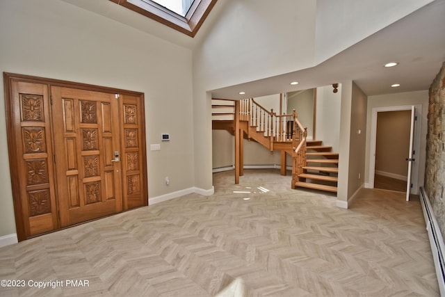386 Camelback Rd, Tannersville, PA 18372 - entryway featuring a skylight, a baseboard heating unit, baseboards, and stairs