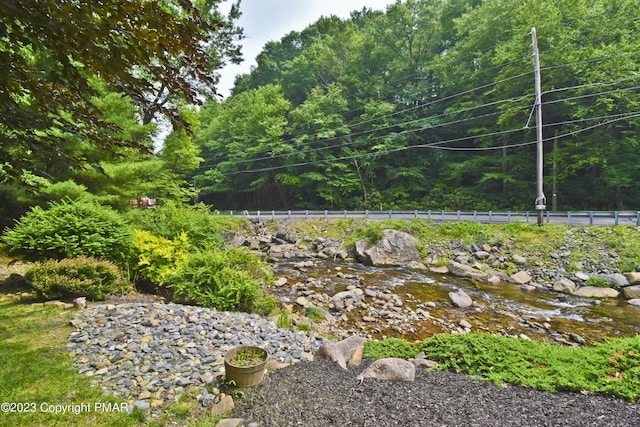 386 Camelback Rd, Tannersville, PA 18372 - view of yard featuring a wooded view and fence