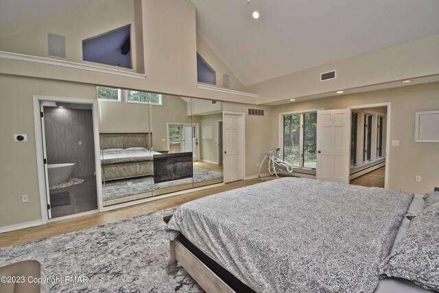 386 Camelback Rd, Tannersville, PA 18372 - bedroom featuring wood finished floors, high vaulted ceiling, visible vents, and recessed lighting