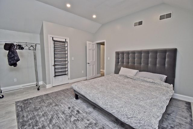 386 Camelback Rd, Tannersville, PA 18372 - bedroom with visible vents, baseboards, vaulted ceiling, and wood finished floors