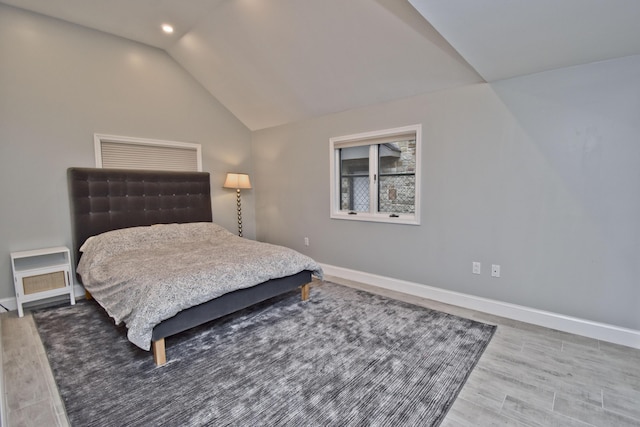 386 Camelback Rd, Tannersville, PA 18372 - bedroom featuring wood finished floors, baseboards, and vaulted ceiling