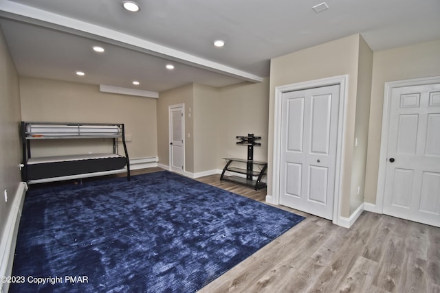386 Camelback Rd, Tannersville, PA 18372 - bedroom featuring a baseboard radiator, wood finished floors, baseboards, and recessed lighting