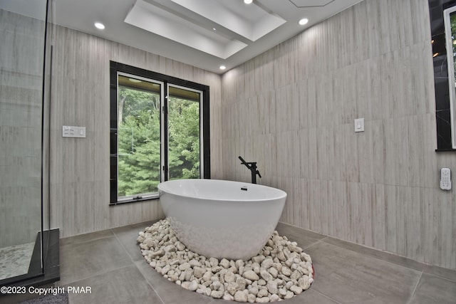 386 Camelback Rd, Tannersville, PA 18372 - full bath featuring concrete floors, a tile shower, recessed lighting, and a soaking tub