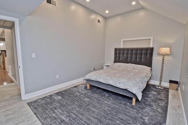 386 Camelback Rd, Tannersville, PA 18372 - bedroom with lofted ceiling, visible vents, baseboards, and wood finished floors