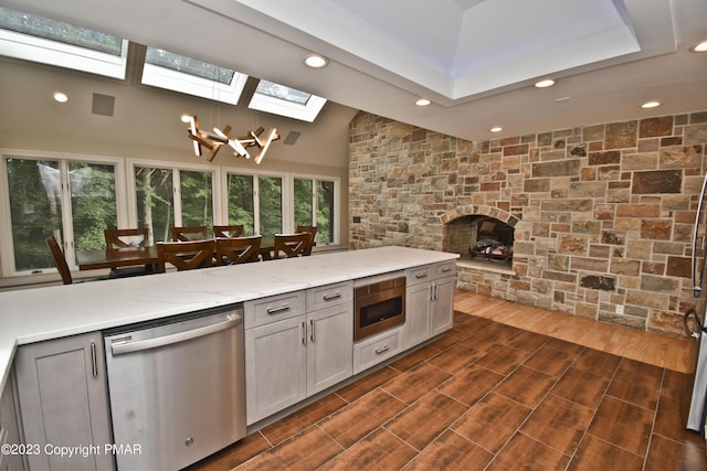 386 Camelback Rd, Tannersville, PA 18372 - kitchen with stainless steel appliances, recessed lighting, light stone counters, and a skylight
