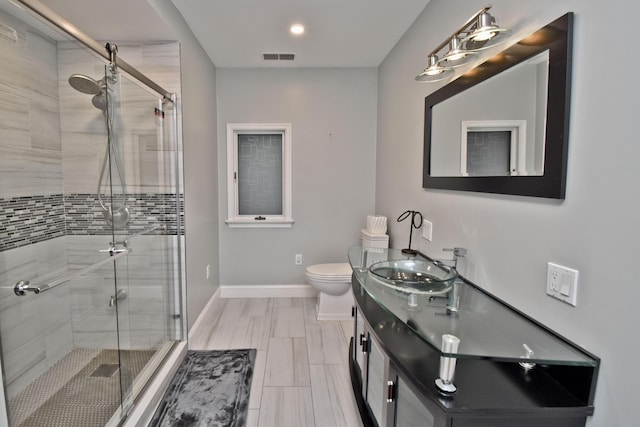 386 Camelback Rd, Tannersville, PA 18372 - bathroom featuring toilet, baseboards, a shower stall, and vanity