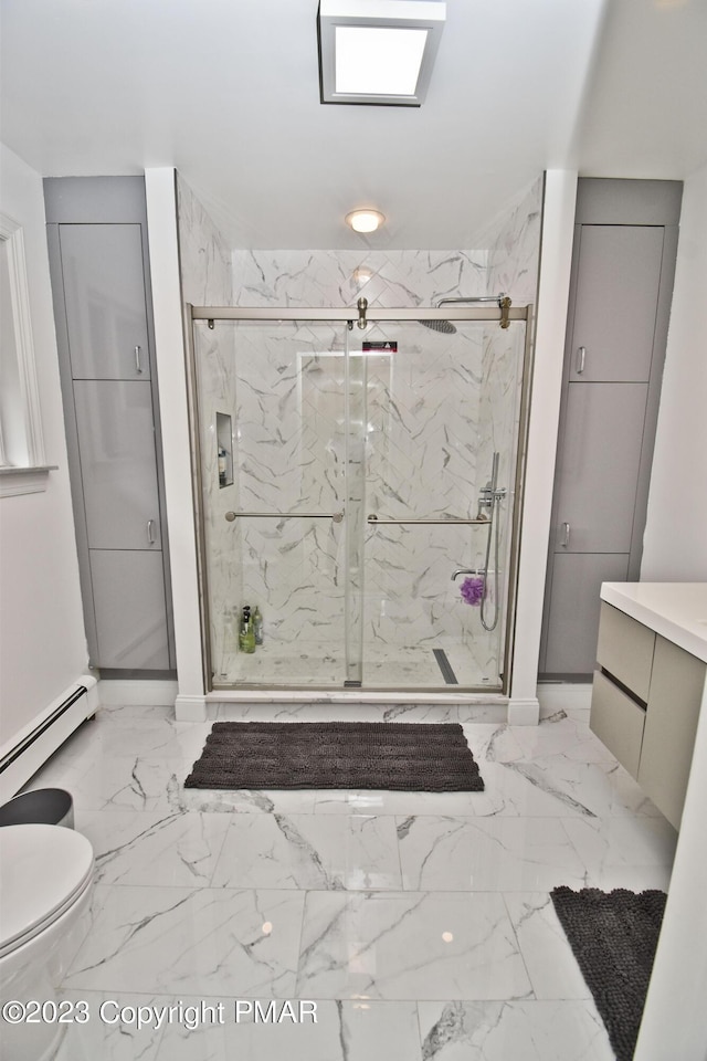 386 Camelback Rd, Tannersville, PA 18372 - full bath with a baseboard heating unit, toilet, marble finish floor, and a marble finish shower