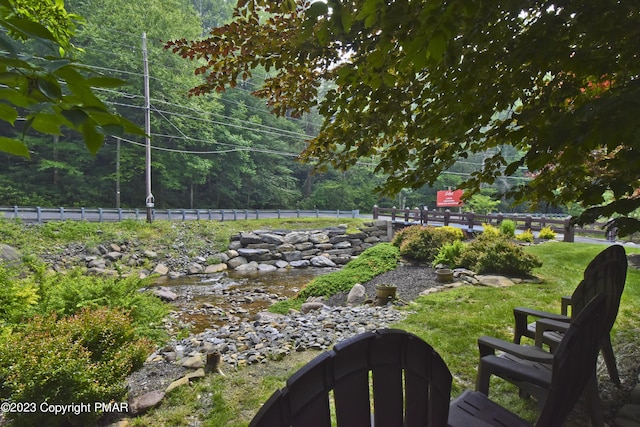 386 Camelback Rd, Tannersville, PA 18372 - view of yard featuring a forest view and fence