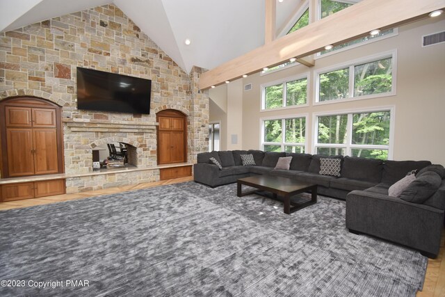 386 Camelback Rd, Tannersville, PA 18372 - living room with visible vents, high vaulted ceiling, and a fireplace
