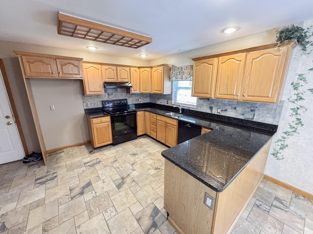 3708 Bayberry Dr, Danielsville, PA 18038 - kitchen featuring black appliances, under cabinet range hood, dark stone countertops, a peninsula, and decorative backsplash