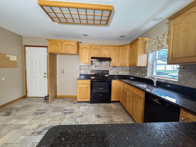 3708 Bayberry Dr, Danielsville, PA 18038 - kitchen with black appliances, under cabinet range hood, tasteful backsplash, light stone finish flooring, and dark stone countertops