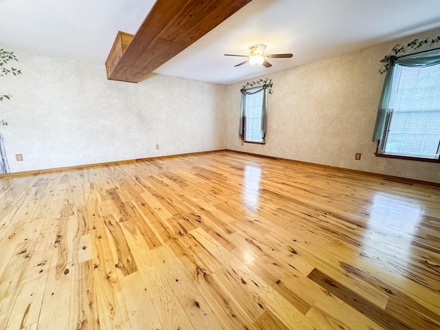 3708 Bayberry Dr, Danielsville, PA 18038 - empty room with light wood-type flooring, a ceiling fan, and beamed ceiling