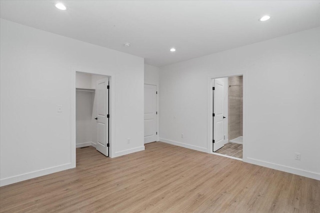 156 Crabapple Ln, Kunkletown, PA 18058 - unfurnished bedroom with light wood-style flooring, a spacious closet, recessed lighting, a closet, and ensuite bath