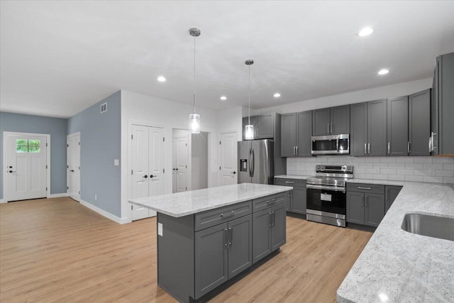 156 Crabapple Ln, Kunkletown, PA 18058 - kitchen featuring appliances with stainless steel finishes, gray cabinetry, a kitchen island, light wood finished floors, and recessed lighting