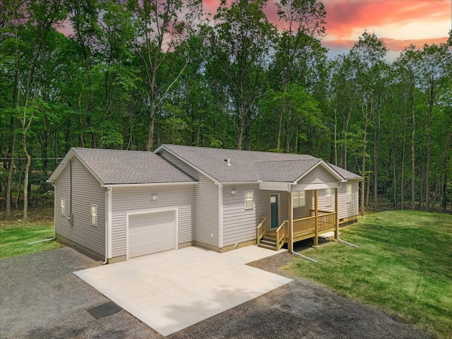156 Crabapple Ln, Kunkletown, PA 18058 - view of front of house featuring concrete driveway, a garage, roof with shingles, a yard, and a deck