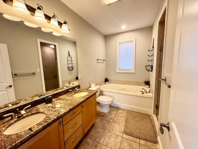 full bath featuring tile patterned floors, a sink, a garden tub, and a stall shower