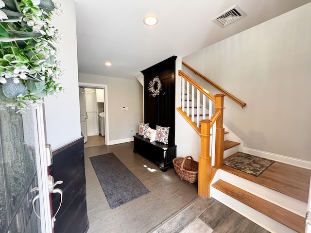 entrance foyer featuring visible vents, stairs, wood finished floors, baseboards, and recessed lighting