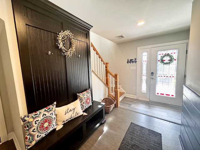 mudroom featuring baseboards, recessed lighting, wood finished floors, and visible vents