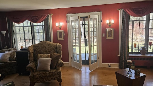 455 Laurel Pine Rd, Cresco, PA 18326 - doorway with radiator heating unit, wood finished floors, and baseboards