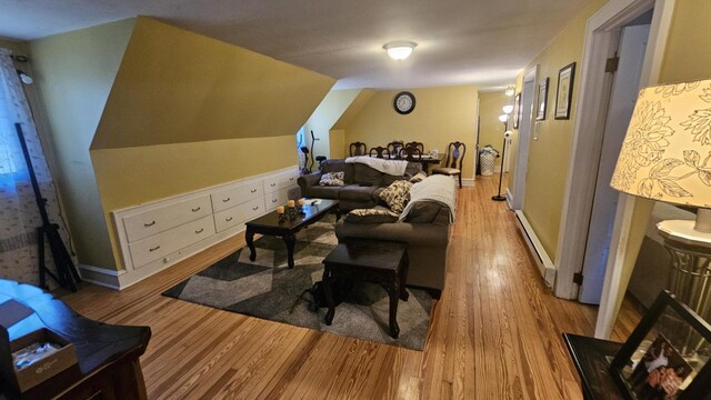 455 Laurel Pine Rd, Cresco, PA 18326 - living area featuring a baseboard heating unit, wood finished floors, and baseboards