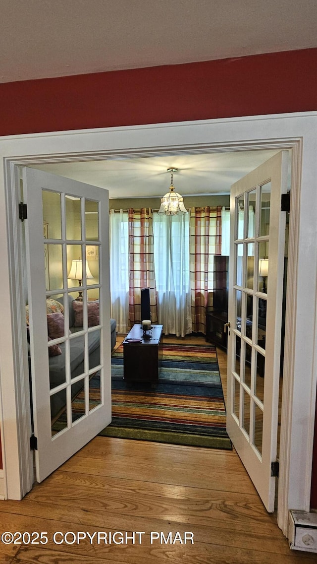 455 Laurel Pine Rd, Cresco, PA 18326 - dining space featuring french doors, wood finished floors, and a chandelier