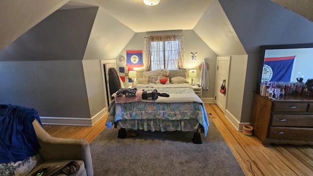 455 Laurel Pine Rd, Cresco, PA 18326 - bedroom featuring light wood finished floors, baseboards, and vaulted ceiling