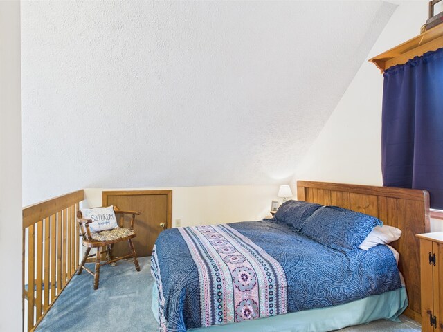 199 Wyomissing Dr, Pocono Lake, PA 18347 - carpeted bedroom with lofted ceiling and a textured ceiling