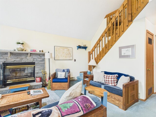 199 Wyomissing Dr, Pocono Lake, PA 18347 - living room featuring carpet, stairs, and a stone fireplace