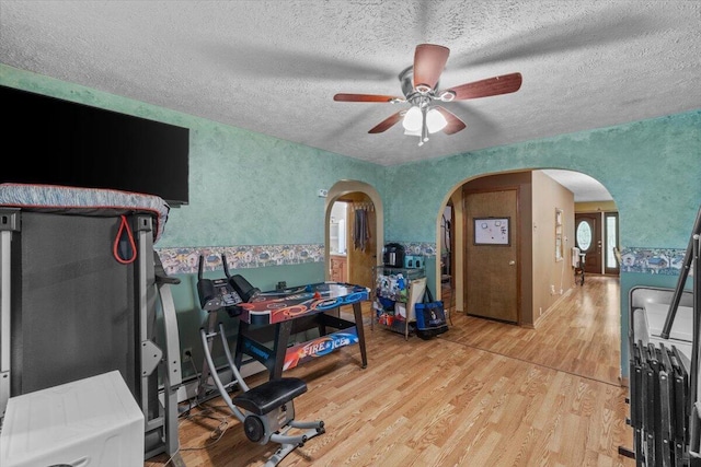 2726 Pocono Cir, Bartonsville, PA 18321 - office space with arched walkways, ceiling fan, light wood finished floors, and a textured ceiling